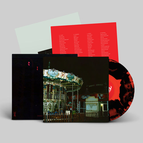 Black and Red Smash vinyl LP mockup for trauma ray's EP 'Carnival', released February 2026 by Dais Records.